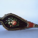 Bellows: Wood and leather finished in black japanning: gold border with floral folk art design